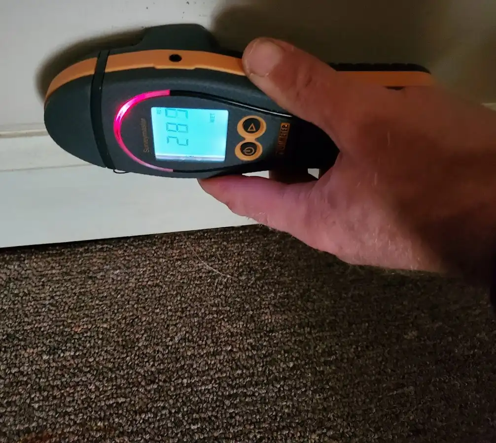 Moisture detection at baseboard during Storm Damage Restoration in Goshen